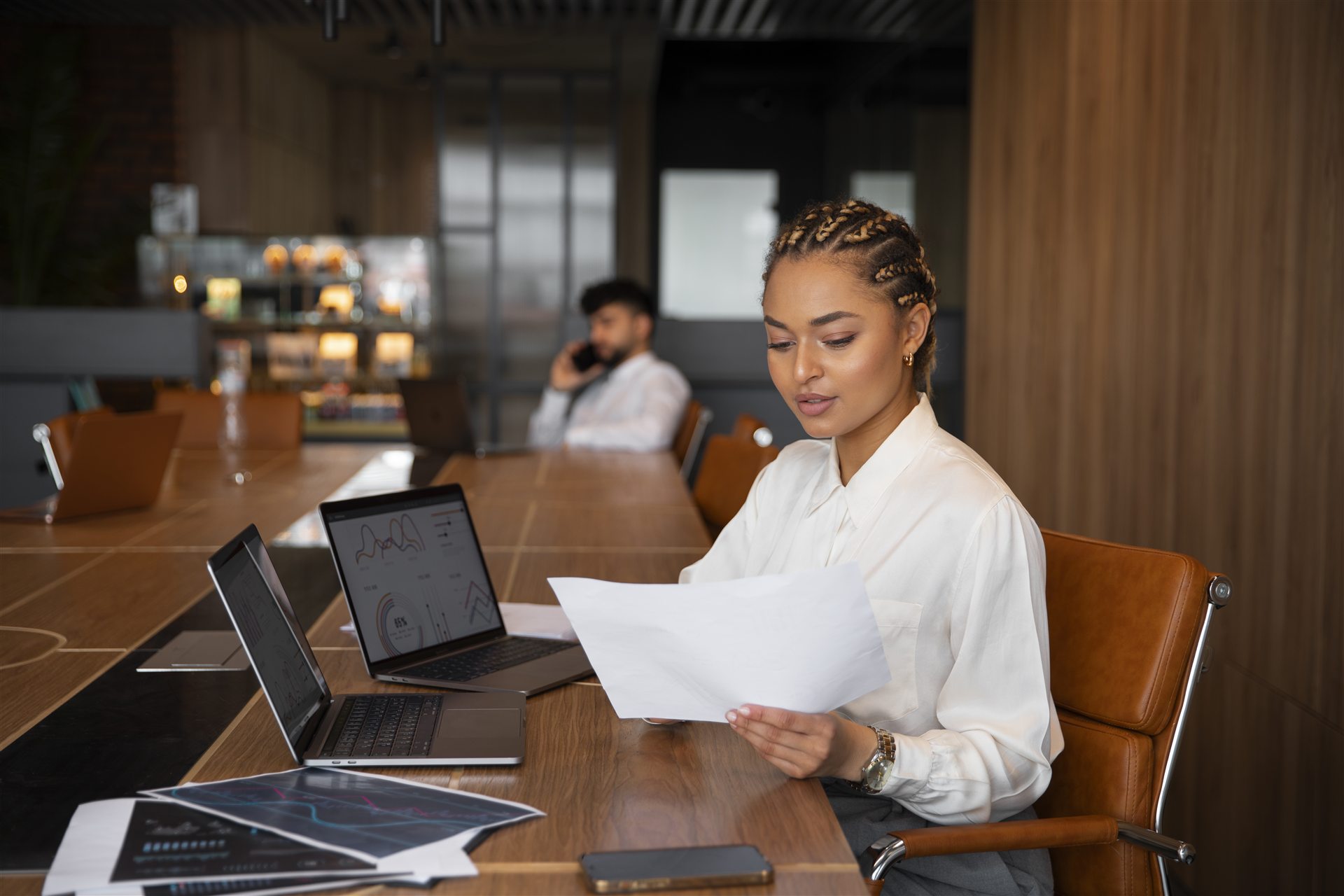 Finance team reviewing business reports in a modern office